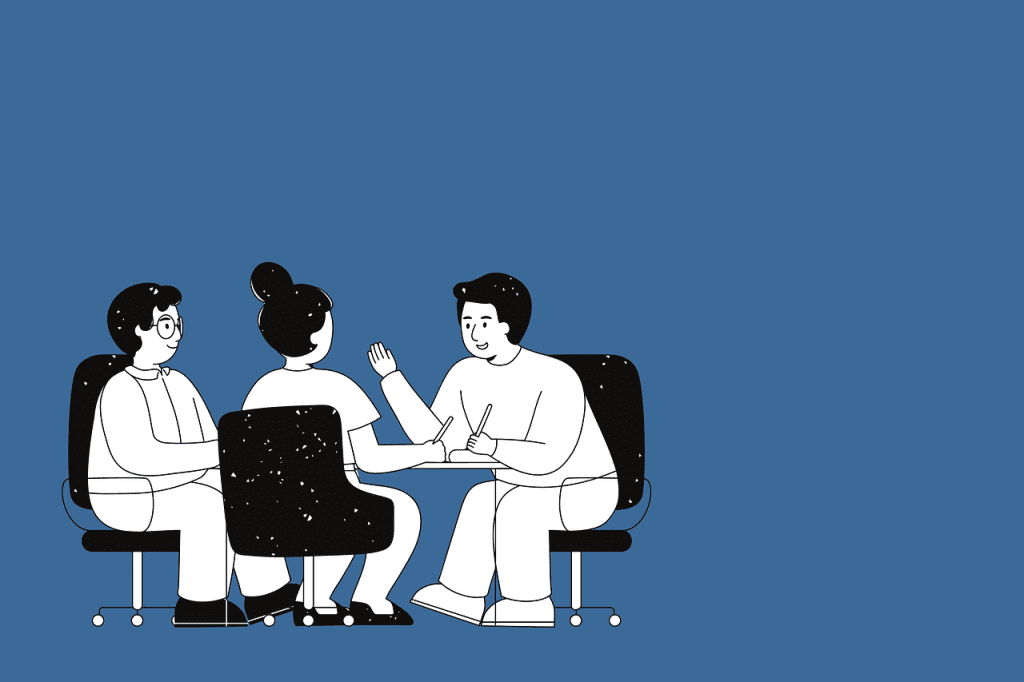A cartoon of three people sat around a table talking and smiling